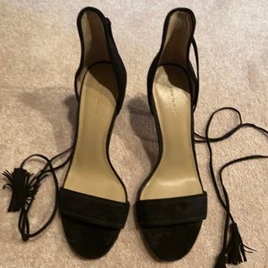 Black suede heels with ankle wrap tassels